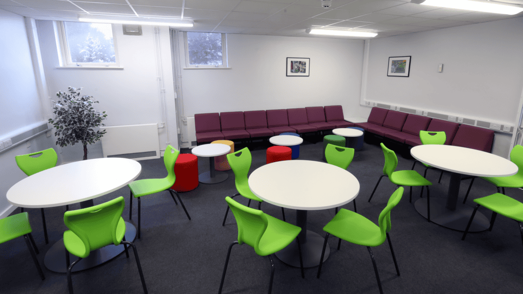 Common room at Colton Hills showcasing Sixth Form spaces with soft seating and workstations.